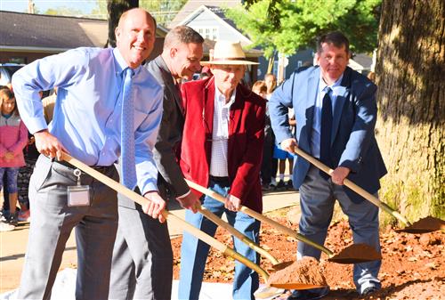 Mayor Finley, Superintendent Parker, Principal Jamie Golliver, former Principal W.R. Foutch with shovels at time capsule. 